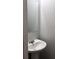 Clean powder room featuring a pedestal sink, a framed mirror, and neutral decor at 3518 Sable Glen, South Fulton, GA 30349