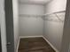Walk-in closet featuring wood-look flooring and wire shelving for ample storage at 3518 Sable Glen, South Fulton, GA 30349