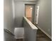 Upper hallway boasting modern flooring, fresh paint, and access to bedrooms at 3518 Sable Glen, South Fulton, GA 30349
