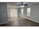 Open-concept living area with wood-look flooring and ample natural light from windows with blinds at 3518 Sable Glen, South Fulton, GA 30349