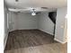 Spacious living room boasts modern flooring, a ceiling fan, and natural light from a large window at 3518 Sable Glen, South Fulton, GA 30349