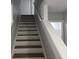 Bright staircase featuring wood stairs, white risers, and a clean, modern design at 3518 Sable Glen, South Fulton, GA 30349