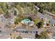 Aerial view of community townhomes with mature trees, parking and community pool at 382 Leisure Sw Ct, Marietta, GA 30064