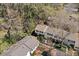 Aerial view of townhomes in a wooded setting with surrounding landscape at 382 Leisure Sw Ct, Marietta, GA 30064