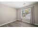 Bedroom featuring wood-look flooring, window, and neutral paint at 382 Leisure Sw Ct, Marietta, GA 30064