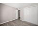 Bedroom with wood-look floors and white closet at 382 Leisure Sw Ct, Marietta, GA 30064