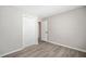 Bedroom with wood-look floors and white closet at 382 Leisure Sw Ct, Marietta, GA 30064