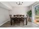 Dining area featuring wood table, chairs, and sliding glass door to the outdoors at 382 Leisure Sw Ct, Marietta, GA 30064