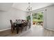 Dining room with wood table and chairs illuminated by modern chandelier at 382 Leisure Sw Ct, Marietta, GA 30064