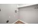 Laundry room with washer and dryer hookups and overhead shelving for storage at 382 Leisure Sw Ct, Marietta, GA 30064