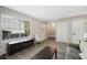 Spacious living area with a window, closet, and a staircase entrance at 382 Leisure Sw Ct, Marietta, GA 30064