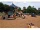 Community playground featuring climbing structures, slides and interactive play stations at 382 Leisure Sw Ct, Marietta, GA 30064