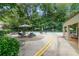 Community pool area with tables, lounge chairs, and mature landscaping at 382 Leisure Sw Ct, Marietta, GA 30064