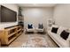 Basement featuring a TV, rug, furniture, and stylish decorations at 884 Mayfield Rd, Milton, GA 30009