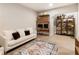 Finished basement with couch, modern furniture, desk and stylish shelving at 884 Mayfield Rd, Milton, GA 30009
