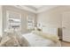 This bedroom features hard wood floors and a natural color palette at 884 Mayfield Rd, Milton, GA 30009
