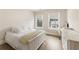 This bedroom features hard wood floors and multiple windows for natural light at 884 Mayfield Rd, Milton, GA 30009
