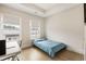 Bright bedroom with hardwood floors, white trim, and two windows providing ample natural light at 884 Mayfield Rd, Milton, GA 30009
