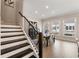 Dining area with stairway and stylish seating arrangement near natural light at 884 Mayfield Rd, Milton, GA 30009