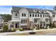 Attractive townhome with porch, dormer windows and professional landscaping at 884 Mayfield Rd, Milton, GA 30009