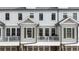 A detailed close-up view of townhome exteriors featuring private balconies and traditional shutters at 884 Mayfield Rd, Milton, GA 30009
