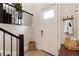 Bright foyer with hardwood floors, coat hooks, and convenient access to the staircase at 884 Mayfield Rd, Milton, GA 30009