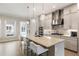 Well-appointed kitchen with granite countertops, a central island, and stainless steel appliances at 884 Mayfield Rd, Milton, GA 30009