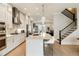 Modern kitchen with gas range, stainless appliances, and breakfast bar island at 884 Mayfield Rd, Milton, GA 30009