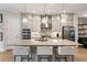 Bright, modern kitchen with an island, stainless appliances, and open layout at 884 Mayfield Rd, Milton, GA 30009