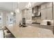 Spacious kitchen with a large island, modern appliances, and stylish pendant lighting at 884 Mayfield Rd, Milton, GA 30009