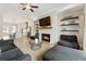 Inviting living room features a cozy fireplace, modern decor, and abundant natural light at 884 Mayfield Rd, Milton, GA 30009