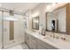 The bathroom features a double sink vanity and a walk in shower at 884 Mayfield Rd, Milton, GA 30009