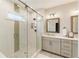 The main bathroom has a walk in shower and double sink vanity at 884 Mayfield Rd, Milton, GA 30009