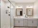 The main bathroom features a double sink vanity and walk in shower at 884 Mayfield Rd, Milton, GA 30009