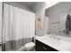 Well-lit bathroom with gray and white accents, featuring a modern vanity and shower with curtain at 2468 Skyland Ne Dr # 32, Atlanta, GA 30319