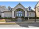 This is a clubhouse for a neighborhood with flower beds and gray siding at 2468 Skyland Ne Dr # 32, Atlanta, GA 30319