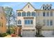 Charming two-story townhome with brick facade, gray shutters, and attached two-car garage at 2468 Skyland Ne Dr # 32, Atlanta, GA 30319