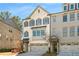 This is a brick townhome with a two car garage and black shutters on the windows at 2468 Skyland Ne Dr # 32, Atlanta, GA 30319