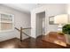 Hallway with hardwood floors, staircase, large window, and access to other rooms at 2468 Skyland Ne Dr # 32, Atlanta, GA 30319