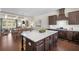Gourmet kitchen featuring a center island, granite countertops, and open access to the living space at 2468 Skyland Ne Dr # 32, Atlanta, GA 30319