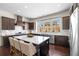 Stylish kitchen with an expansive island, dark wood cabinetry, and stainless steel appliances at 2468 Skyland Ne Dr # 32, Atlanta, GA 30319