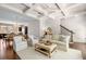 Bright, open living room with coffered ceilings, hardwood floors, and views to the kitchen and dining area at 2468 Skyland Ne Dr # 32, Atlanta, GA 30319