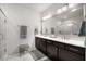 A spacious main bathroom features a walk-in shower, dual vanities, and white marble flooring at 2468 Skyland Ne Dr # 32, Atlanta, GA 30319