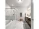 A luxurious main bathroom boasts marble tile, a glass shower, a soaking tub, and dual vanities at 2468 Skyland Ne Dr # 32, Atlanta, GA 30319