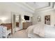 A comfortable main bedroom with tray ceiling, closet and bathroom entrance, and light color tones at 2468 Skyland Ne Dr # 32, Atlanta, GA 30319