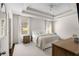 A well-lit main bedroom features a tray ceiling, and two windows with neutral-colored decor at 2468 Skyland Ne Dr # 32, Atlanta, GA 30319