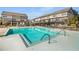 The community pool has multiple lounge chairs, a pergola, and is surrounded by townhomes at 2468 Skyland Ne Dr # 32, Atlanta, GA 30319
