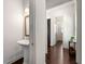 Stylish powder room with hardwood floors, pedestal sink, and elegant decor at 2468 Skyland Ne Dr # 32, Atlanta, GA 30319