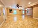 Open basement area with tiled flooring, ceiling fans, and natural light at 2921 Royston Dr, Duluth, GA 30097