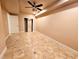 Basement area featuring tiled flooring, a closet, and a ceiling fan at 2921 Royston Dr, Duluth, GA 30097